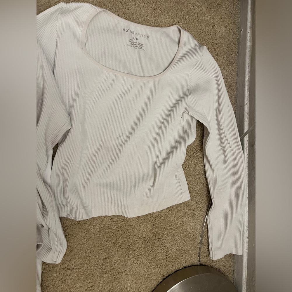 I am selling a white long sleeve that is tight fitting but fits you perfectly